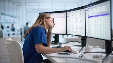 Tired Nurse Using Computer, Facing Stress Stock Footage 338169636