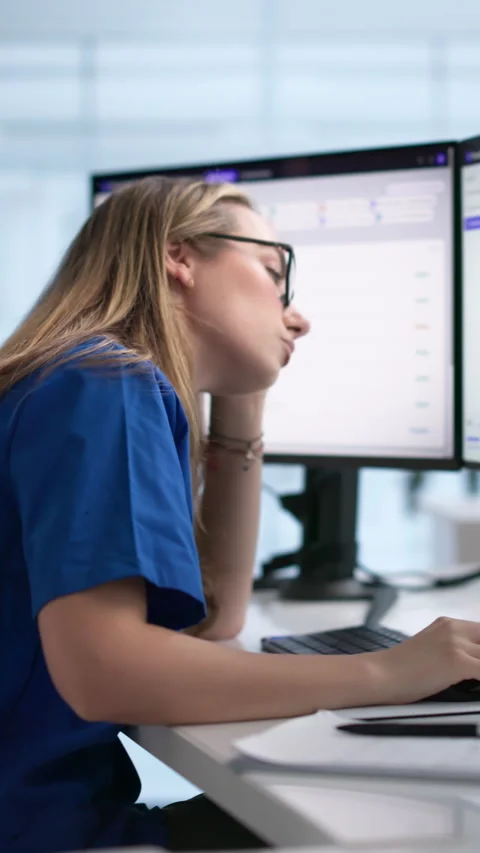 Tired Nurse Using Computer, Facing Stress Stock Footage 340402752