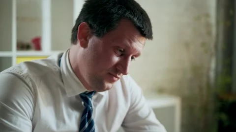 Tired office worker dealing with paperwork. Stock Footage 325728616