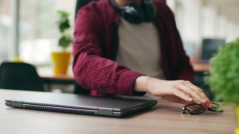 Tired office worker finishes work, takes a break, closes laptop. Overworked Stock Footage 219800153
