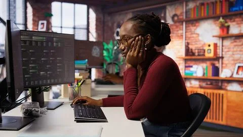 Tired overworked admin in AI startup office getting help from senior manger 스톡 사진