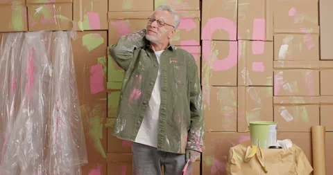 Tired overworked senior man keeps hand on neck suffers pain after refurbishing Stock-Footage 144917475