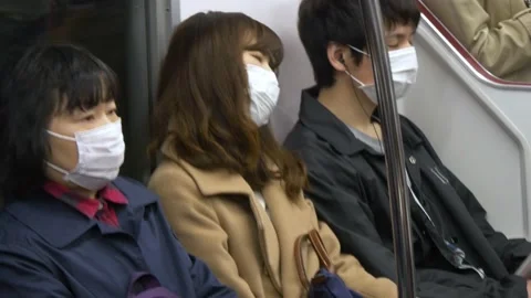 Tired Passengers Inside The Tokyo Metro In Tokyo, Japan Stock Footage 159056979