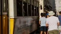 Tired people waiting turn to get on tram that will take them to their homes HD Footage