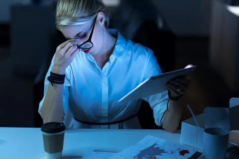Tired programmer feeling exhausted in the office Stock Photos