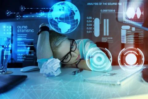 Tired programmer having a nap while being at work and feeling exhausted Stock Photos