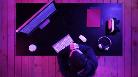 Tired programmer looking at some process on the computer. Foto stock