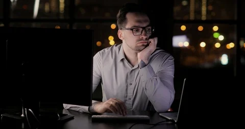 Tired programmer man is working in the office overtime typing on keyboard late Stock Footage 105301877