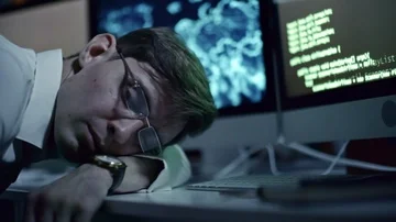 Tired Programmer Sleeping in Office at Night Stock Footage 85826703