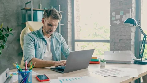 Tired programmer work laptop typing code try perform job impossible terms Video stock 162025640