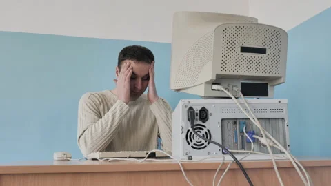 Tired Programmer Is Working On Old Style 1980S 1990S Computer In Office Stock Footage 287873636