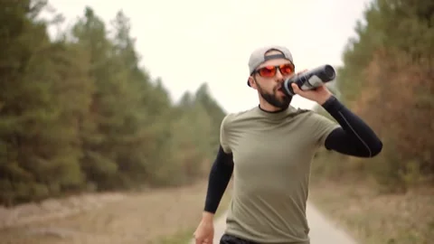 Tired Runner Drinking Water.Runner Drinking Isotonic Drink.Energy Drink Stock Footage 152991244