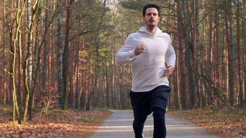 Tired runner suffering from cramp Stock Footage 102830163