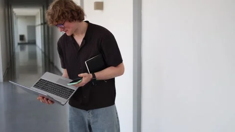 Tired schoolboy studies with laptop Stock Footage 338277117