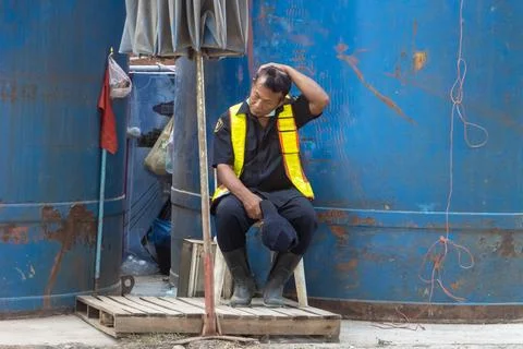 Tired security guard at construction site Stock Photos