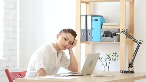 Tired Sleeping Woman in Her Office Stock Footage