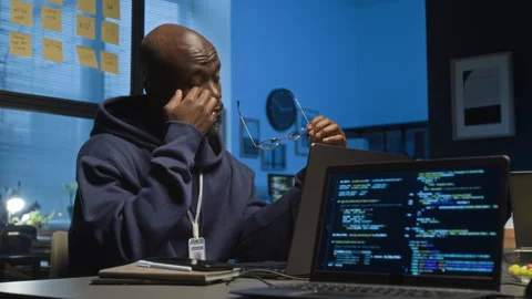 Tired Software Engineer Taking off Glasses, Rubbing Eyes and Continuing Working Stock Footage 329615405