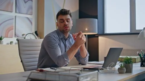 Tired specialist checking papers at creative cabinet closeup. Dissatisfied man Stock Photos