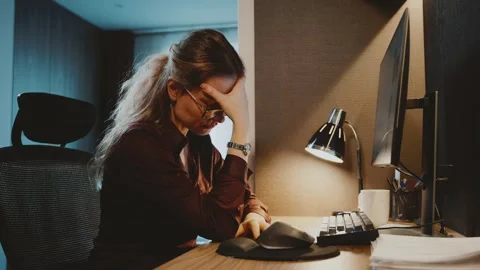 Tired sressed woman working at computer. Person in stress work pc headache late Stock Footage 330063400