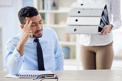 Tired, stack of files and businessman with headache in office for editing report Foto stock