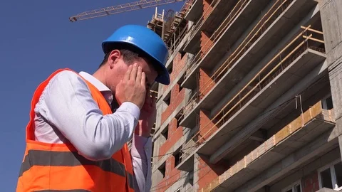 Tired stressed construction workman having site headache ill worker feeling pain Stock Footage 78504741