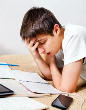 Tired Student doing Homework Foto stock