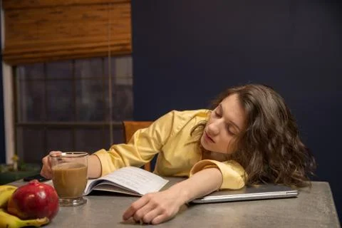 Tired Student in her kitchen Stock Photos