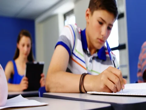 Tired student sleeping in classroom Видео 74589582