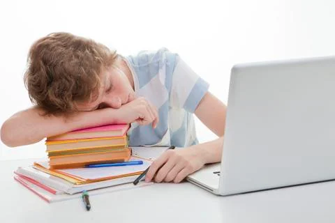 Tired student sleeping with homework Stock Photos