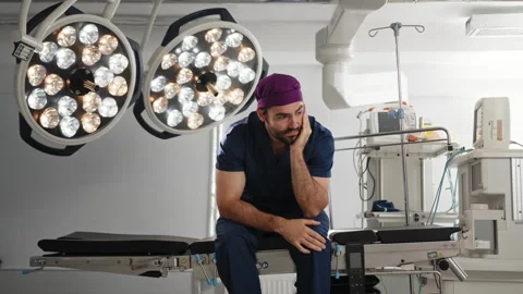 Tired Surgeon in the Operating Room Stock Footage 315979238