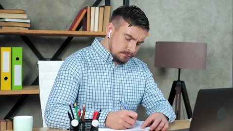 Tired teacher tutor writes in notebook massaging neck after over work at laptop Stock Footage 151525772
