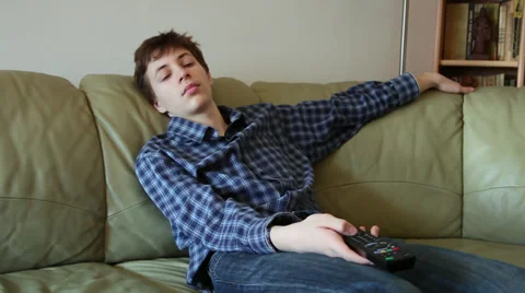 Leon slumped on sofa