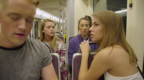 Tired teens ride the max train together Stock Footage 54261302