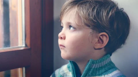 Tired toddler waits his father from work, window Stock Footage 59595519