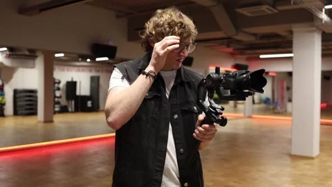 Tired videographer still filming Stock Footage 332116841