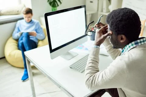 Tired White Collar Worker Using Computer Stock Photos