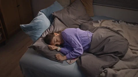 Tired Woman Checking Sleep Tracker on Smartwatch in Bed Stock Footage 344105095