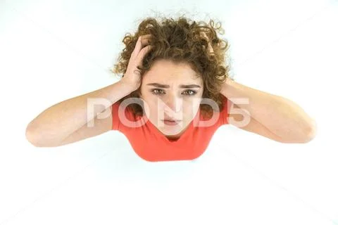 The tired woman look to the camera. View from above Stock Photos