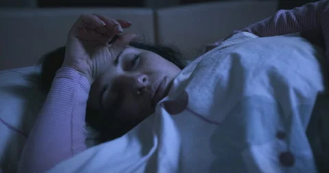 Tired woman napping, cannot fall asleep, shallow sleep. Sleep problems Stock Footage 139775724