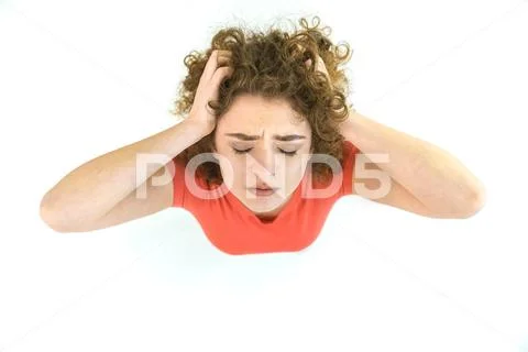 The tired woman stand on the white background. View from above Stock Photos