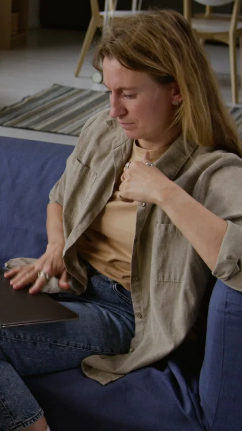 Tired Woman using Computer and Rubbing Eyes Vertical Stock Footage 327686829