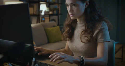 Tired woman working with computer at night Stock Footage 162997876