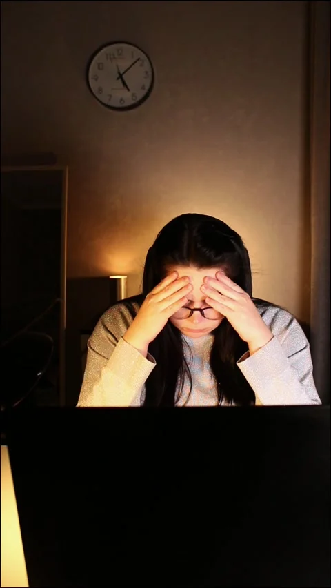 Tired woman working on computer touching her head because of headache. Office Stock Footage 305484615