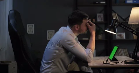 Tired worker look at green digital tablet screen watch webinar read email Stock Footage 276202224