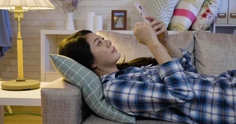 Tired worker relaxing on couch browsing web site Video stock 104131838