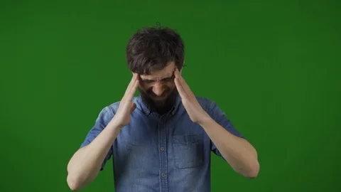 Tired of working on the computer young bearded man in a stylish look rubs his Vídeos de archivo 115032943