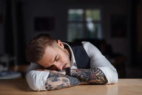 Young businessman with tattooed face using smartphone - a Royalty Free  Stock Photo from Photocase