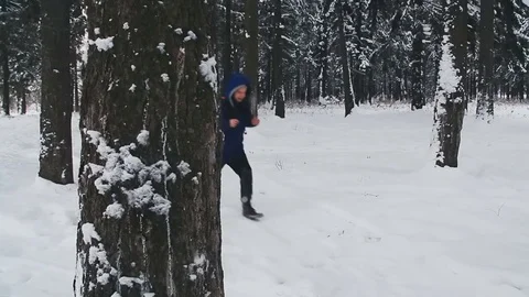 A tired young guy lost in the forest checks the compass Stock Footage 76597756