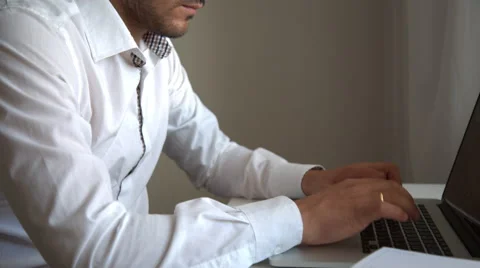 Tired young man sitting over laptop Stock Footage 54094183