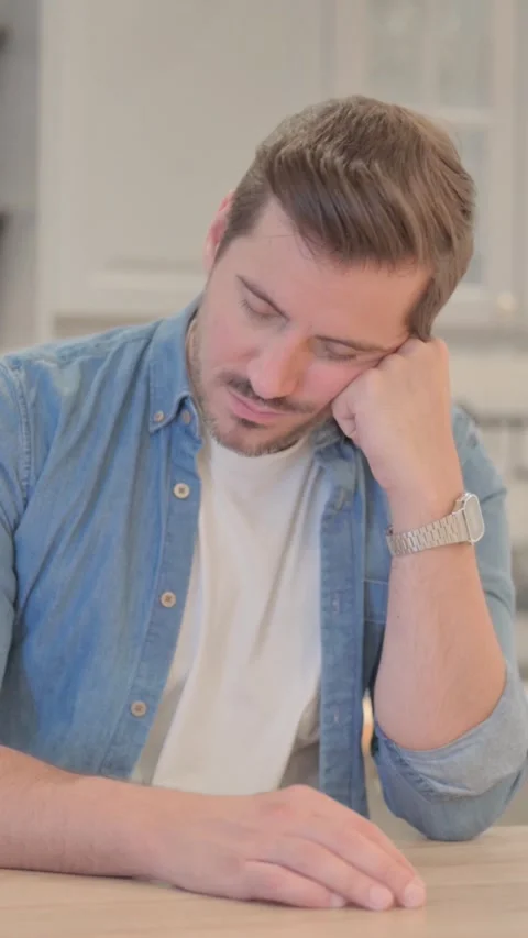 Tired Young Man Sleeping in Office,  Need Rest, vertical video Video stock 328564911